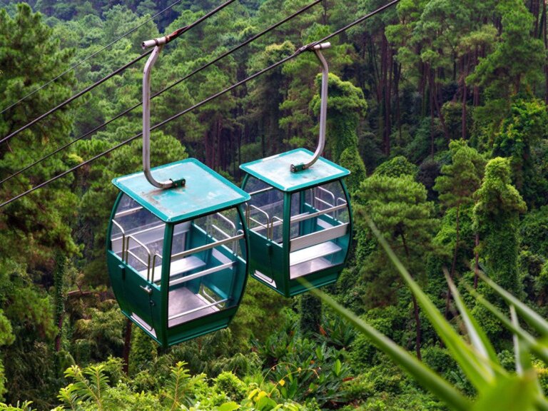 Chairlift and gondola line above a mountain resort